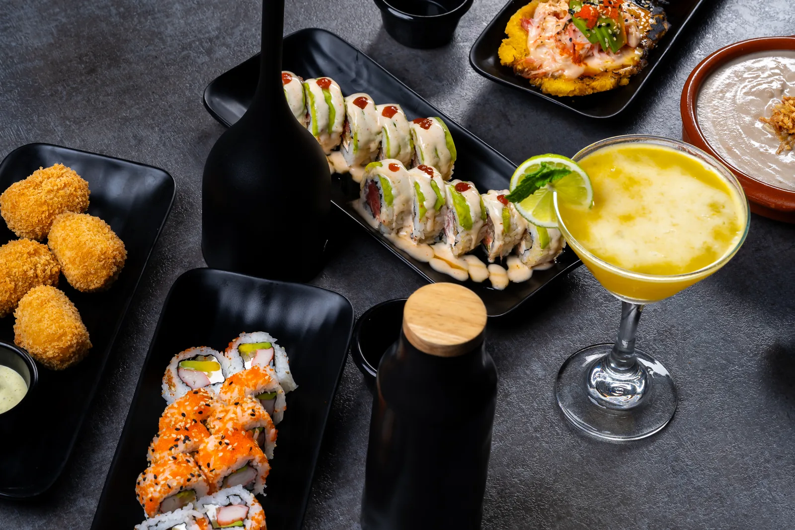 Cocktails and sushi spread on the KamiKoi bar