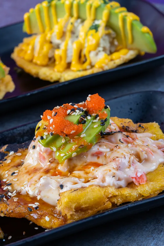 Tostones topped with crab and avocado at KamiKoi