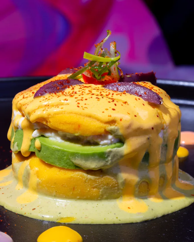 Causa topped with avocado and crab at KamiKoi