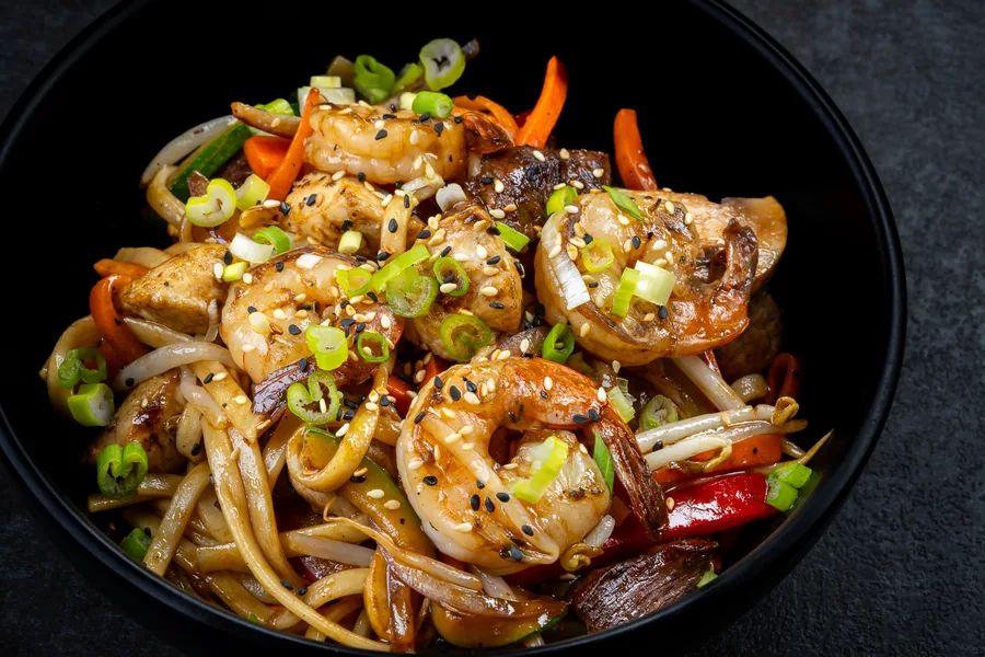 Asian-style wok noodles with shrimp and vegetables at KamiKoi Sushi Fusion